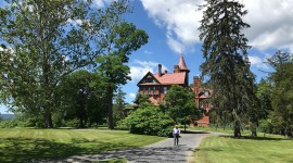 man walking in front of Wilderstein property