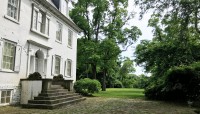 Rear of the mansion with flagstone terrace.