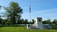Memorial to the right, trees to the left