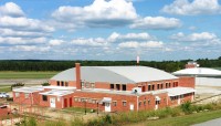 Brick building with cloudy sky backdrop