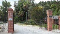 Two brick pillars marking the entrance to the cemetery