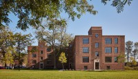 Apartment building; tree and lawn in foreground