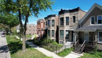 Row of houses with sidewalk and trees