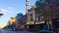 Bustling boulevard with Logan Theater