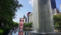 Fountains with wade pool; trees and buildings