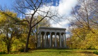 Classical structure on hilltop surrounded by trees