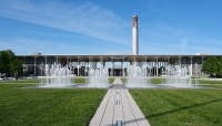 Central path with lawn on either side and fountain in the center