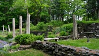 Outdoor rooms bordered by low stone wall