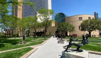 Path through plaza, statue at right