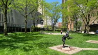Lawn with amphitheater, statue at right