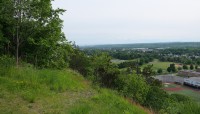 Slope on the boundary of the cemetery overlooks the city