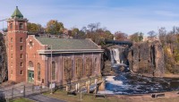 Great Falls Hydroelectric building in foreground; waterfall in background