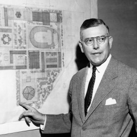 Paul Thiry stands in front of plans for the Seattle Center