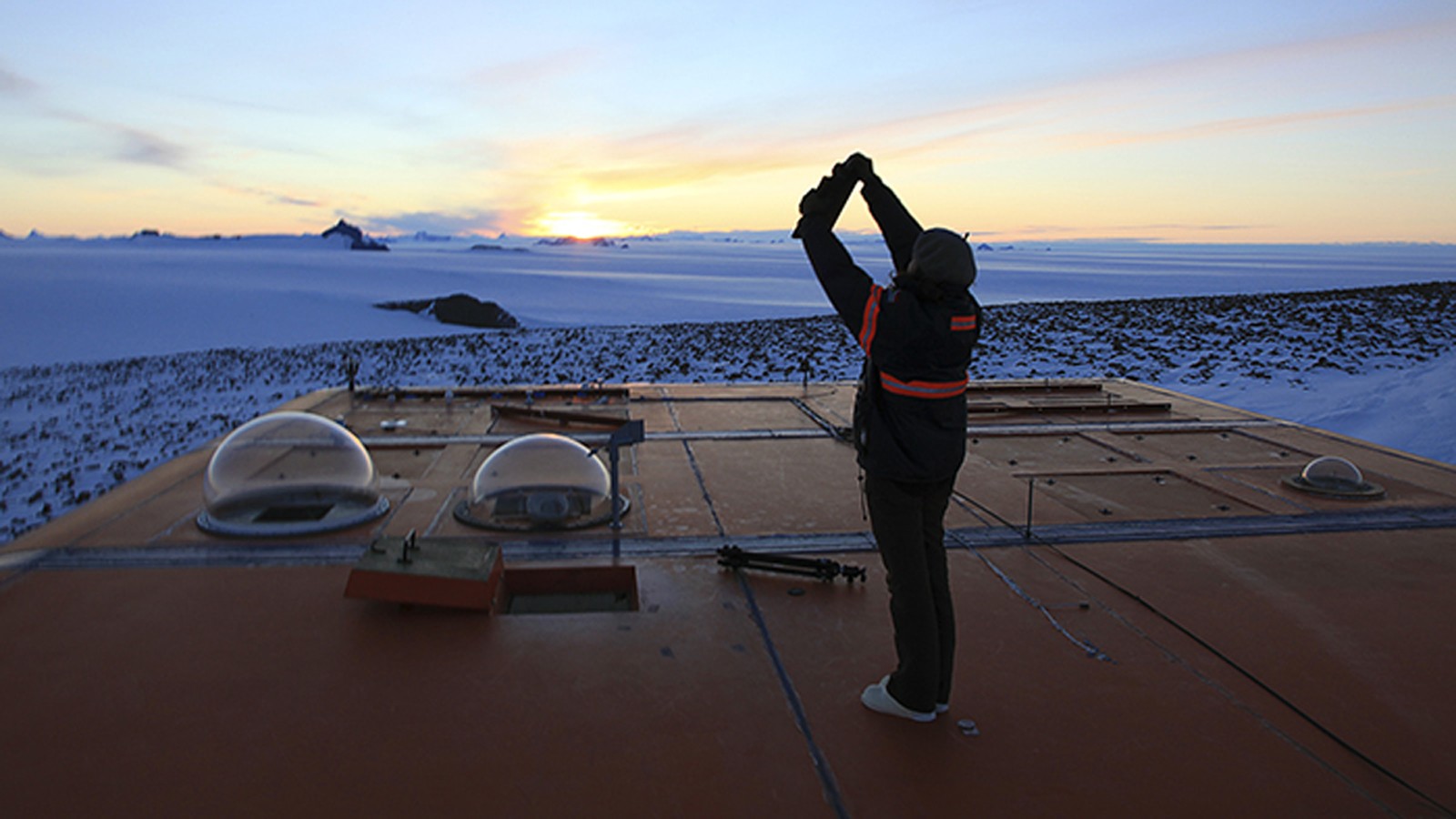 Erika Blumenfeld documenting light phenomena on the roof of SANAE Base Station in Antarctica, 2009 - Photo by Thomas Mulcaire