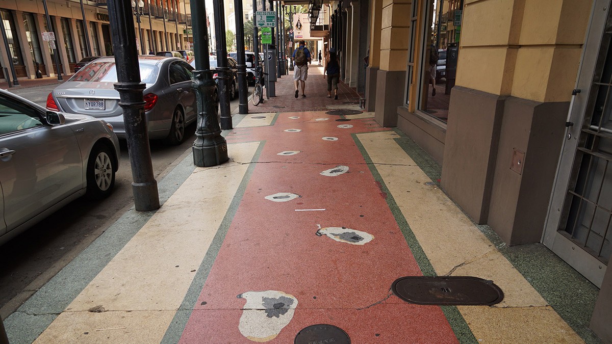 Terrazzo sidewalk paving depicting oysters in front of an oyster bar, New Orleans
