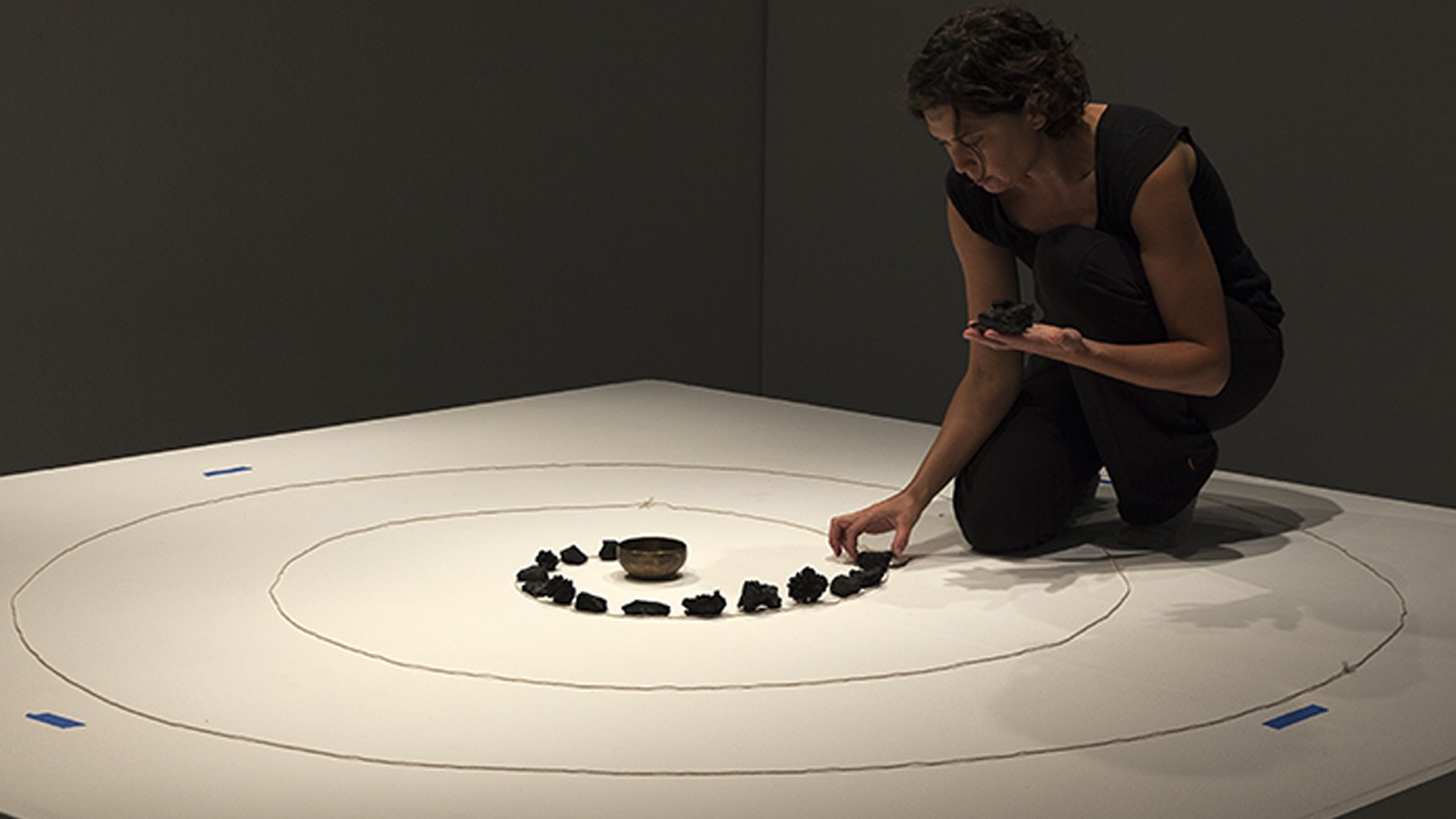 Erika Blumenfeld installing the piece Fire Mandala: Spiral No. 1 from her Wildfire series, which consists of charred debris gathered from the Silver Wildfire (Gila National Forest, NM 2013) - Photo courtesy Erika Blumenfeld