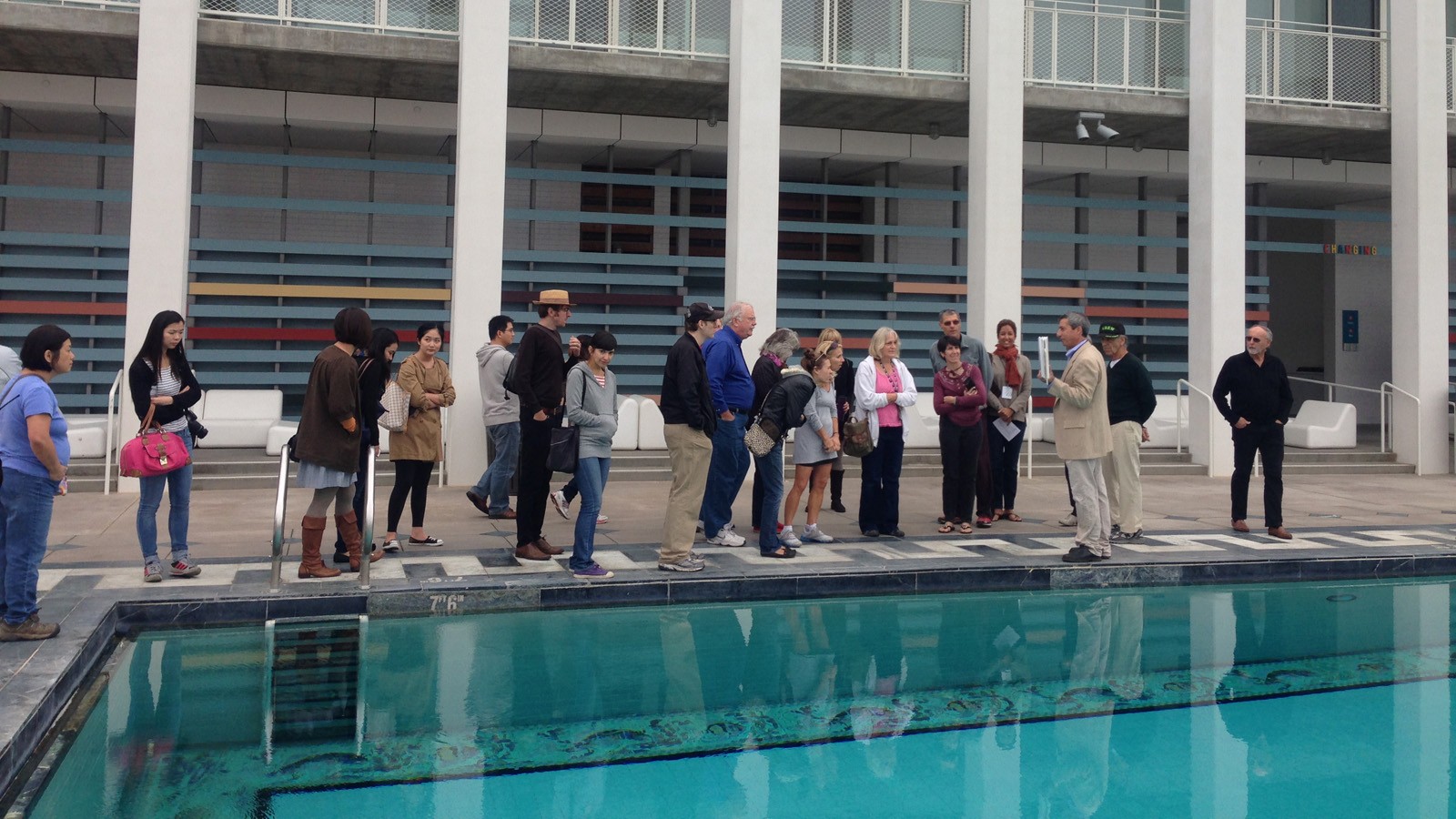 Group by the pool of the Annenberg Community Beach House in Santa Monica