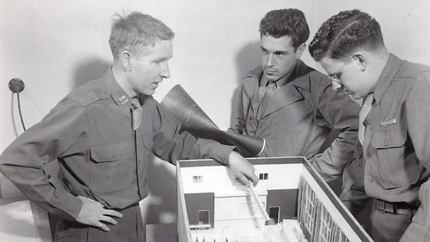 Dan Kiley examines a mock-up of the Nuremburg courtroom.