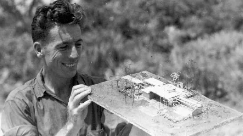 James Rose holding a model of his home while stationed in Okinawa