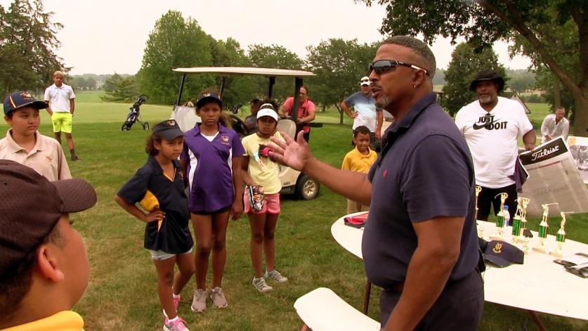 Bronze Foundation President Darwin Dean speaking with participants of the Junior Bronze Tournament at Hiawatha Golf Club