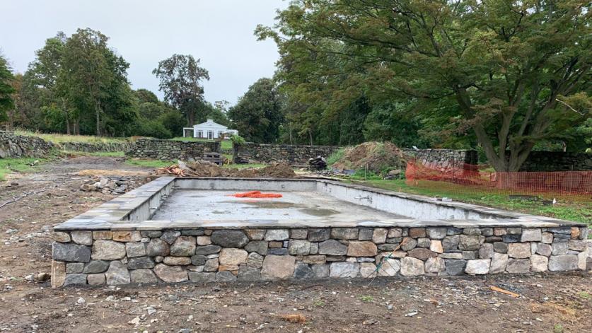 Rehabilitation in progress reincorporating harvested field stones and reclaimed slate, The Jay Estate, Rye, NY