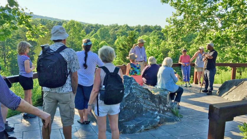 Armand Thieblot addresses a tour group at the Quarries Overlook